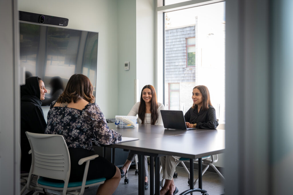 Members of the Alberta Health Services Youth Advisory Council meet in a board room