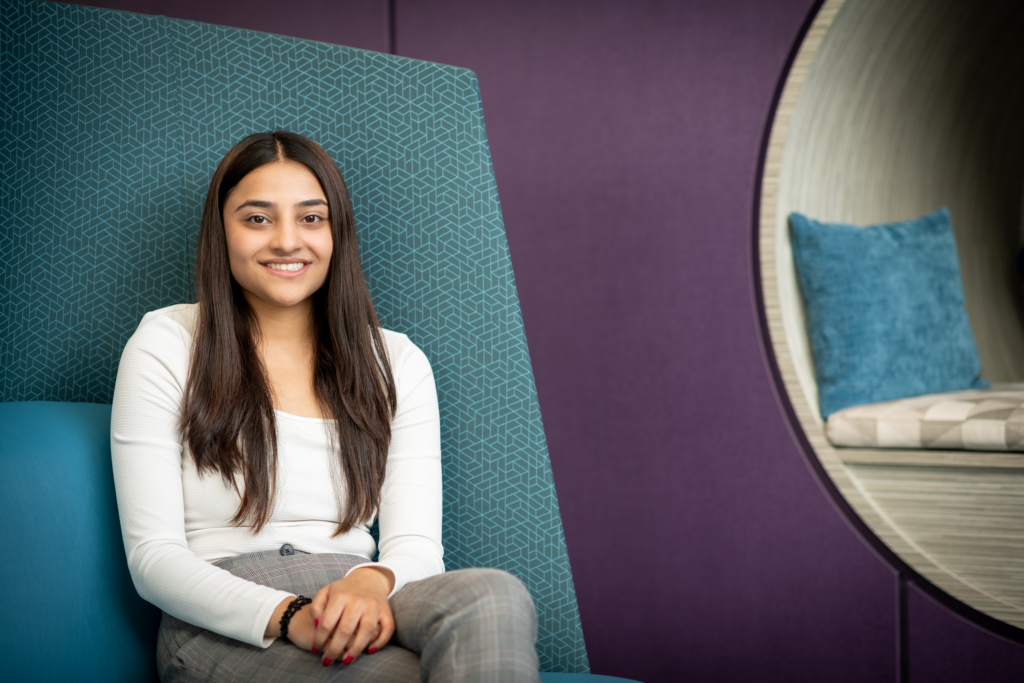 Palak Patel sitting in The Summit: Marian & Jim Sinneave Centre for Youth Resilience
